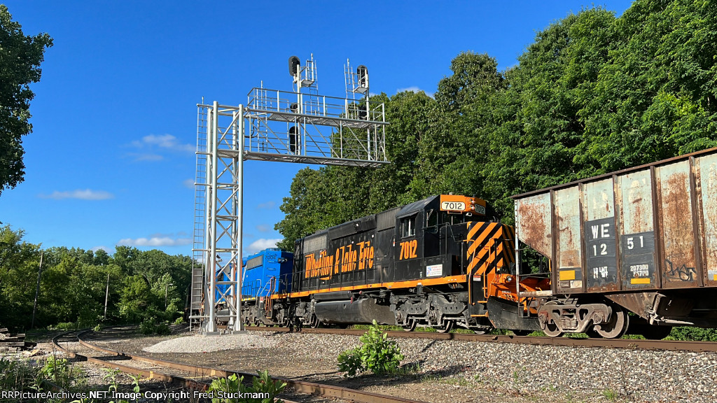 WE 7012 passes under the eastbound signals at BD.